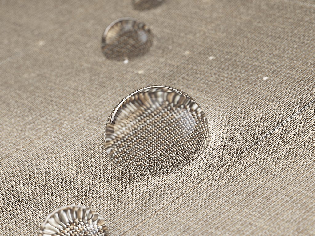 Wassertropfen auf einem strukturierten, beige-farbenen Stoff. Wassertropfen auf einem strukturierten, beige-farbenen Stoff.