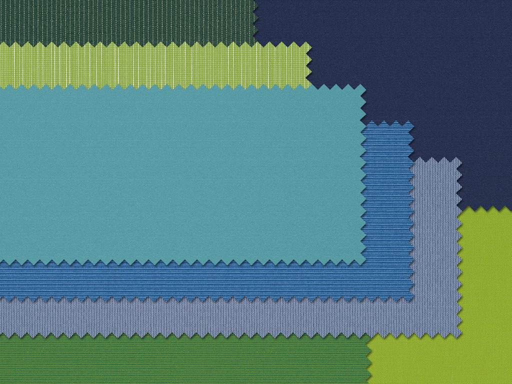Farbenfrohe Stoffmuster in unterschiedlichen grünen und blauen Tönen mit gezackten Kanten.